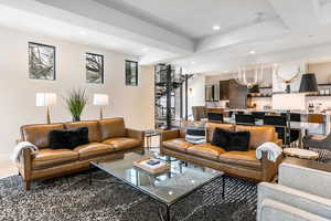 Living room featuring recessed lighting and a chandelier
