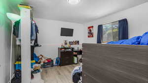 Bedroom featuring wood finished floors