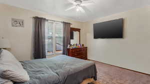Bedroom featuring carpet floors and ceiling fan