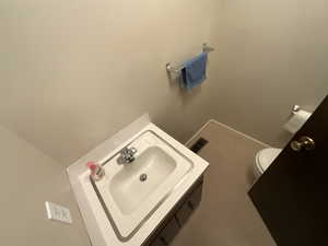 Bathroom with toilet and vanity