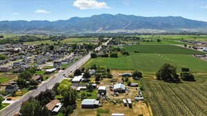 View of rural area featuring extensive farmland and a mountainous background