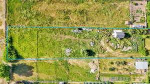 Aerial view of property and surrounding area with property boundaries highlighted