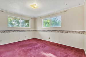 Unfurnished bedroom featuring carpet and ornamental molding