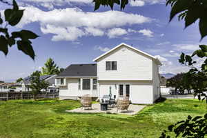 Rear view of property with a patio