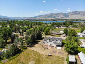 Aerial perspective of suburban area with a water and mountain view