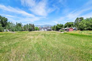 View of yard featuring an outdoor structure and a mountain view