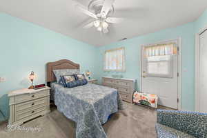 Bedroom with carpet and ceiling fan