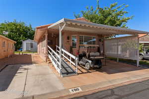 View of patio featuring a ceiling fan