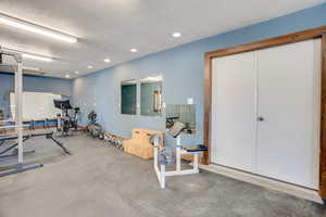 Exercise area featuring recessed lighting
