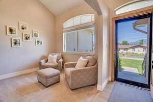 Foyer with lofted ceiling and light wood finished floors