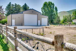 Detached garage featuring a mountain view