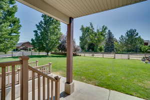 Fenced backyard with a patio area