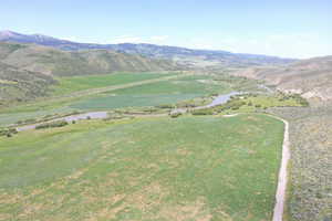 View of mountain background featuring a nearby body of water