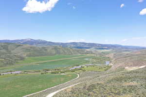 View of mountain backdrop with a large body of water