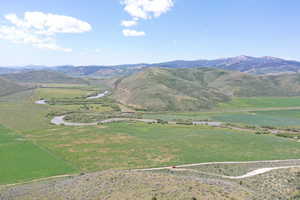 View of mountain background featuring a nearby body of water