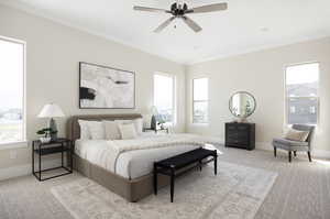 Carpeted bedroom with crown molding and ceiling fan