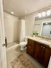 Full bath featuring vanity, tile patterned floors, and a tile shower