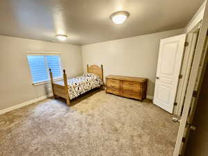 Bedroom featuring carpet flooring