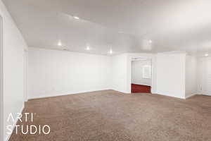 Family room with light carpet and a textured ceiling