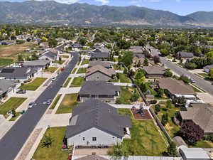 Aerial perspective of suburban area with a mountain backdrop