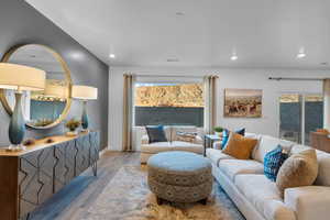 Living room featuring wood finished floors and recessed lighting