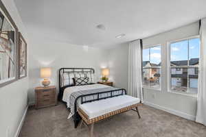 Bedroom with carpet and a textured ceiling