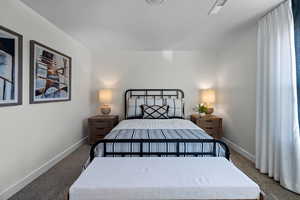 Bedroom with carpet flooring and baseboards