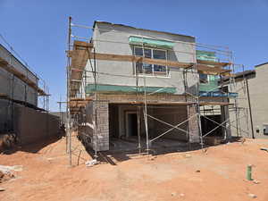 Back of house with stucco siding
