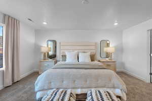 Carpeted bedroom featuring recessed lighting