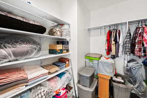 Primary bedroom walk in closet