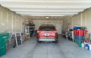 Garage featuring a garage door opener