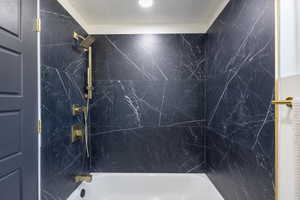 Bathroom featuring shower / bathtub combination