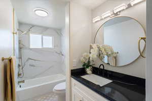 Full bath featuring vanity and bathtub / shower combination