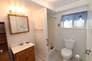 Bathroom with vanity and a shower
