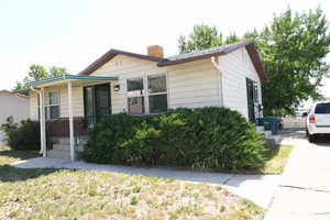 Single story home featuring a chimney