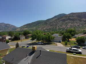 View of mountain backdrop featuring nearby suburban area