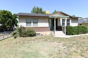 View of front of house with brick siding