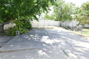 Fenced backyard with a patio area