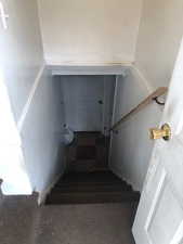 Basement has living room, kitchen, bathroom, bedroom, and laundry room.