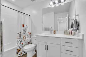 Full bath with vanity and shower / bath combo with shower curtain
