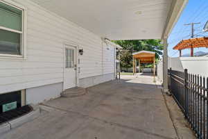View of patio / terrace featuring a carport