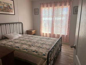 Bedroom with light wood-style floors