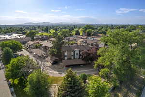 Aerial perspective of suburban area with a mountain backdrop