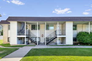View of property featuring stairs