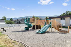 Communal playground featuring a mountain view