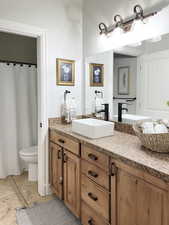 Bedroom featuring carpet flooring and baseboards