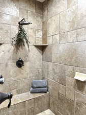 Bathroom featuring a tile shower