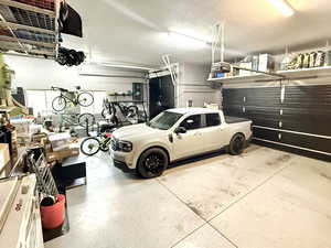 View of patio with a grill