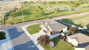 Bird's eye view of a nearby body of water and a golf club