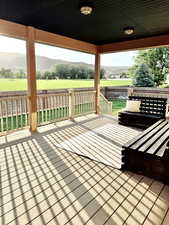 Hall with wood finished floors and baseboards
